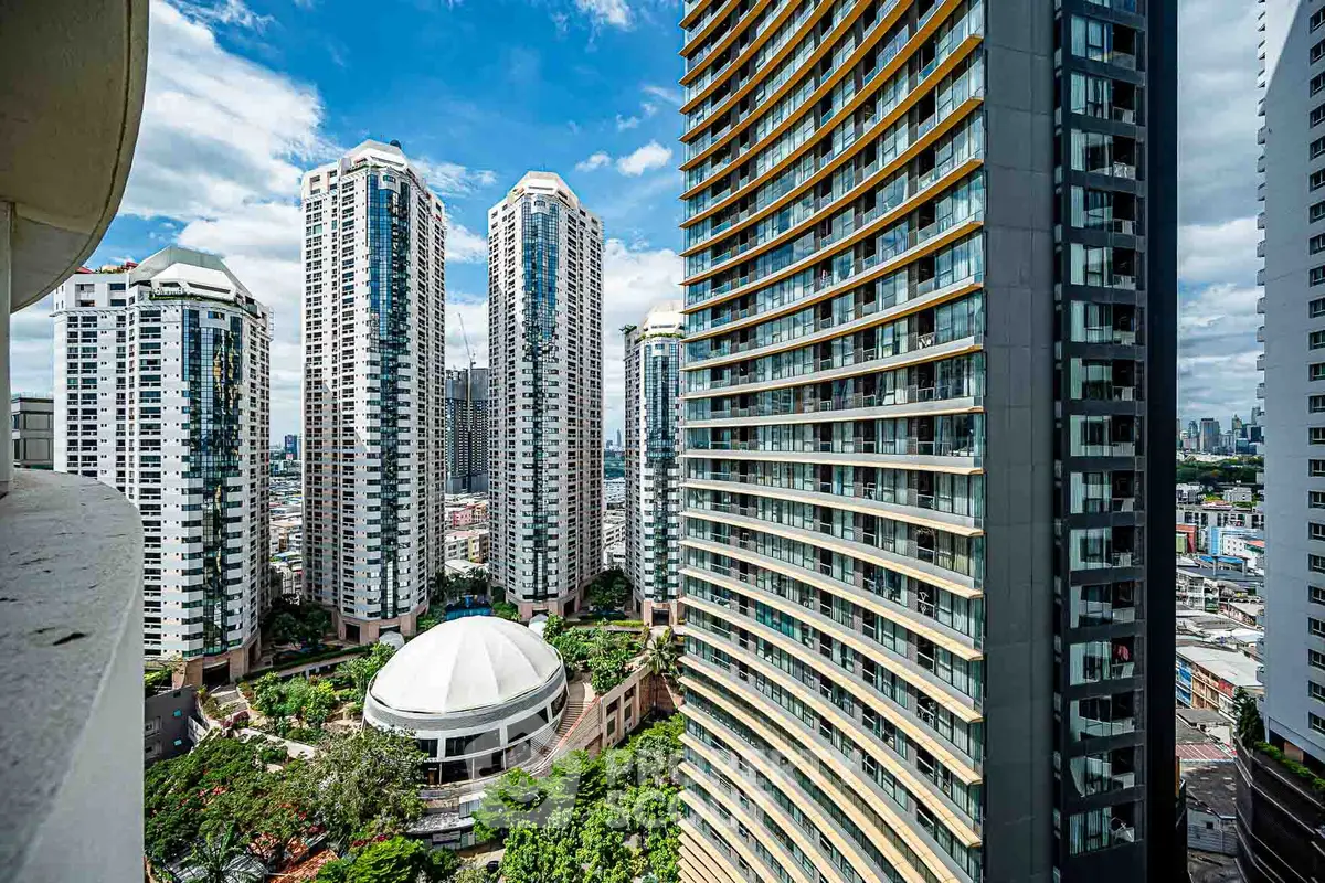 Stunning high-rise buildings with lush greenery and cityscape views, perfect for urban living.