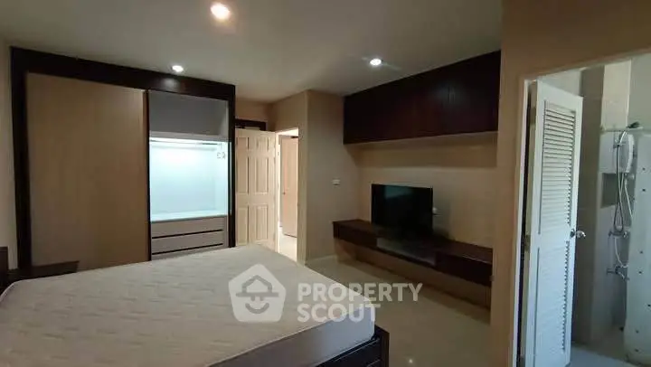 Spacious bedroom with modern built-in wardrobe and ensuite bathroom