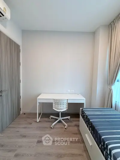 Modern minimalist bedroom with study desk and natural light