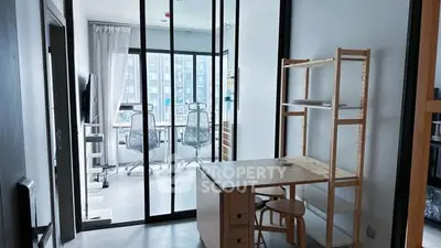 Modern study area with glass partition and natural light