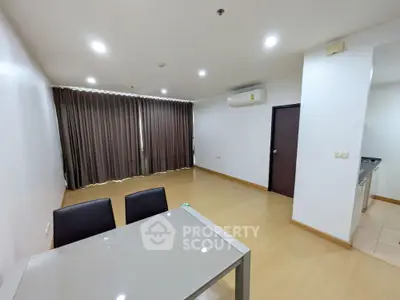 Spacious modern living room with dining area and air conditioning
