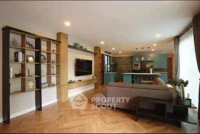 Spacious modern living room with open kitchen and stylish decor