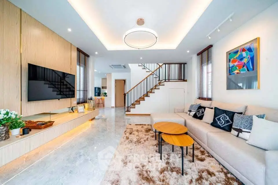 Luxurious modern living room with stylish decor and spacious seating area.