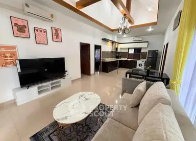Spacious modern living room with open kitchen and elegant decor