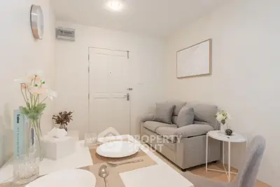 Cozy living room with modern decor and neutral tones, perfect for relaxation.