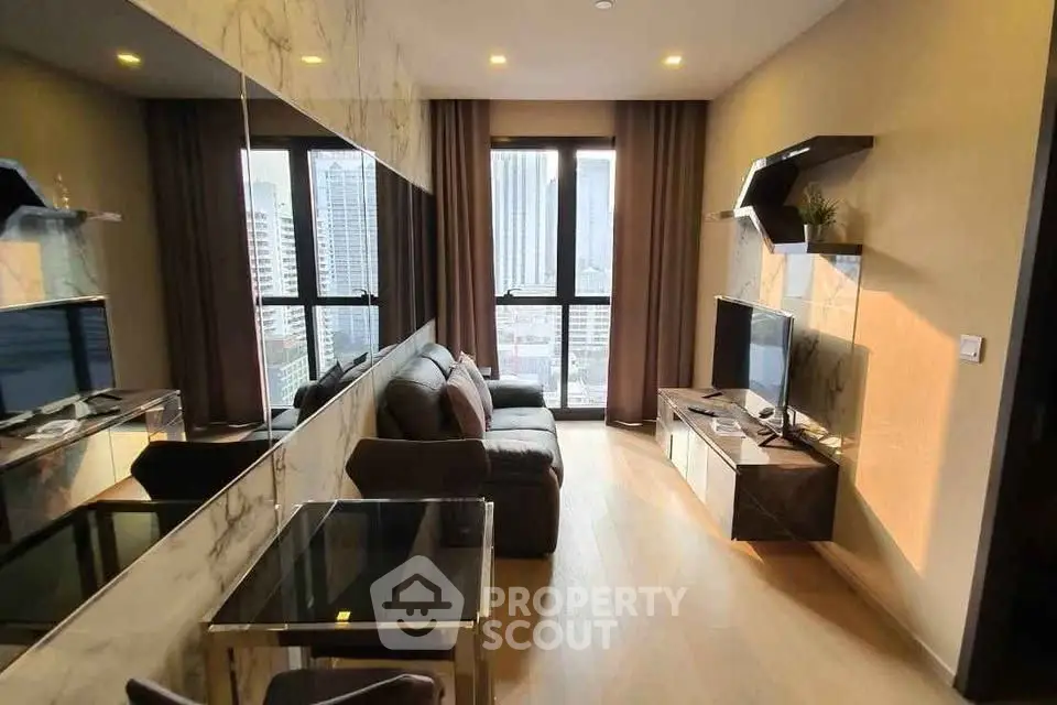 Modern living room with city view, stylish furniture, and large windows in a high-rise apartment.