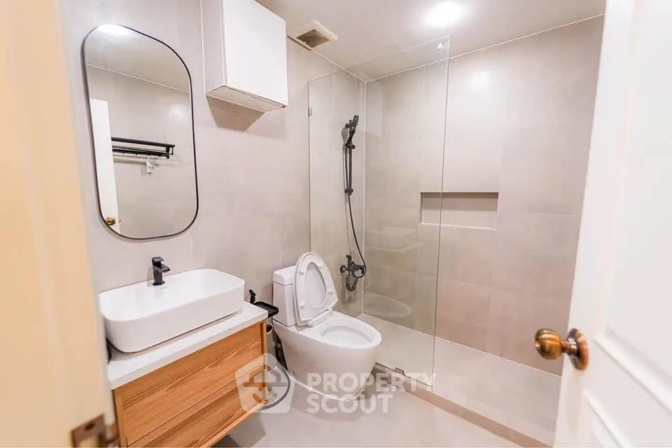 Modern bathroom with sleek design and glass shower enclosure