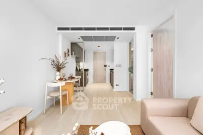 Modern open-plan living room with cozy dining area and stylish decor