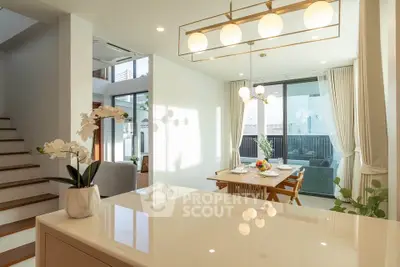 Modern open-plan dining area with natural light and elegant decor