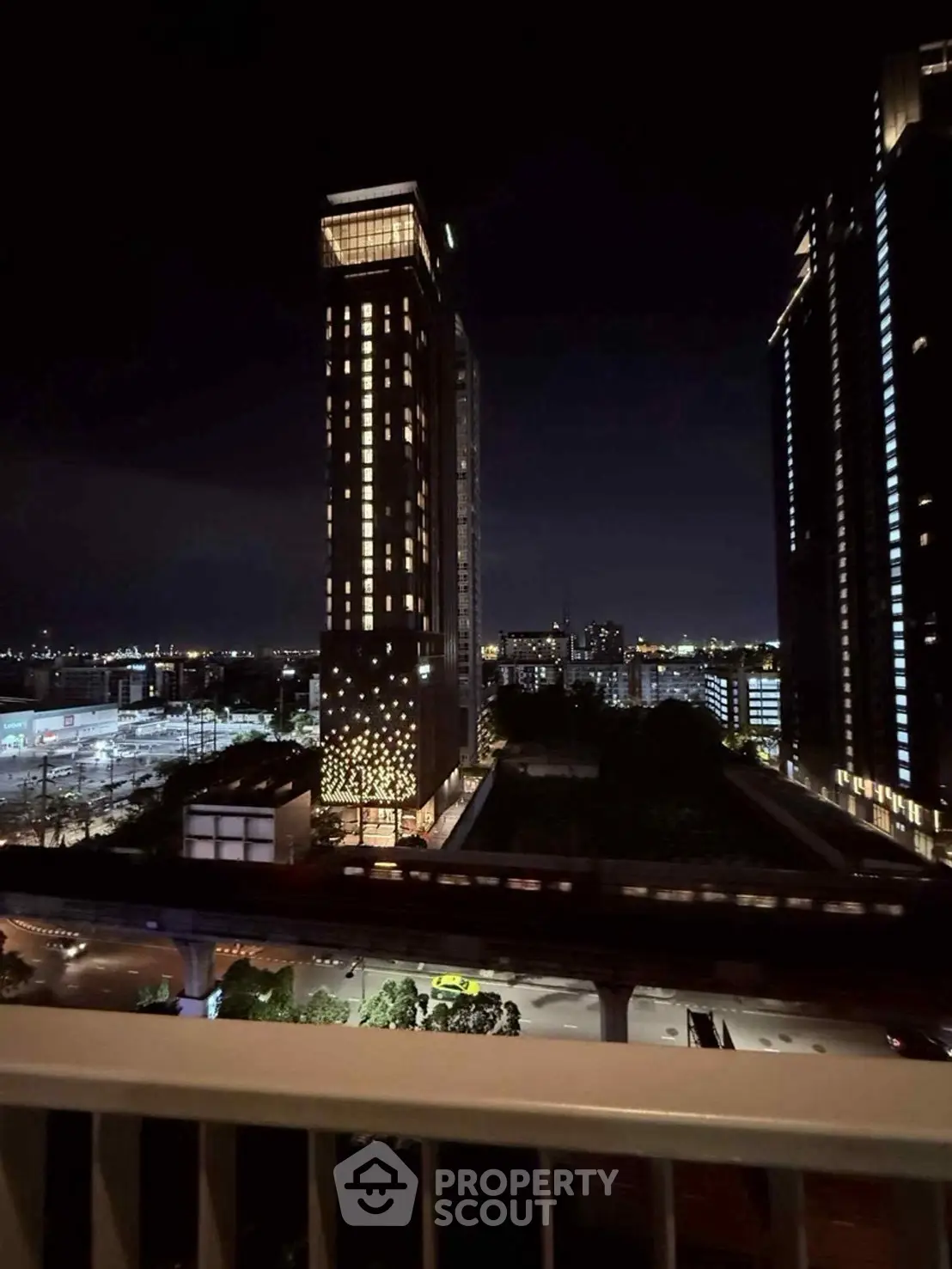 Stunning night view of cityscape with illuminated high-rise buildings and vibrant skyline.