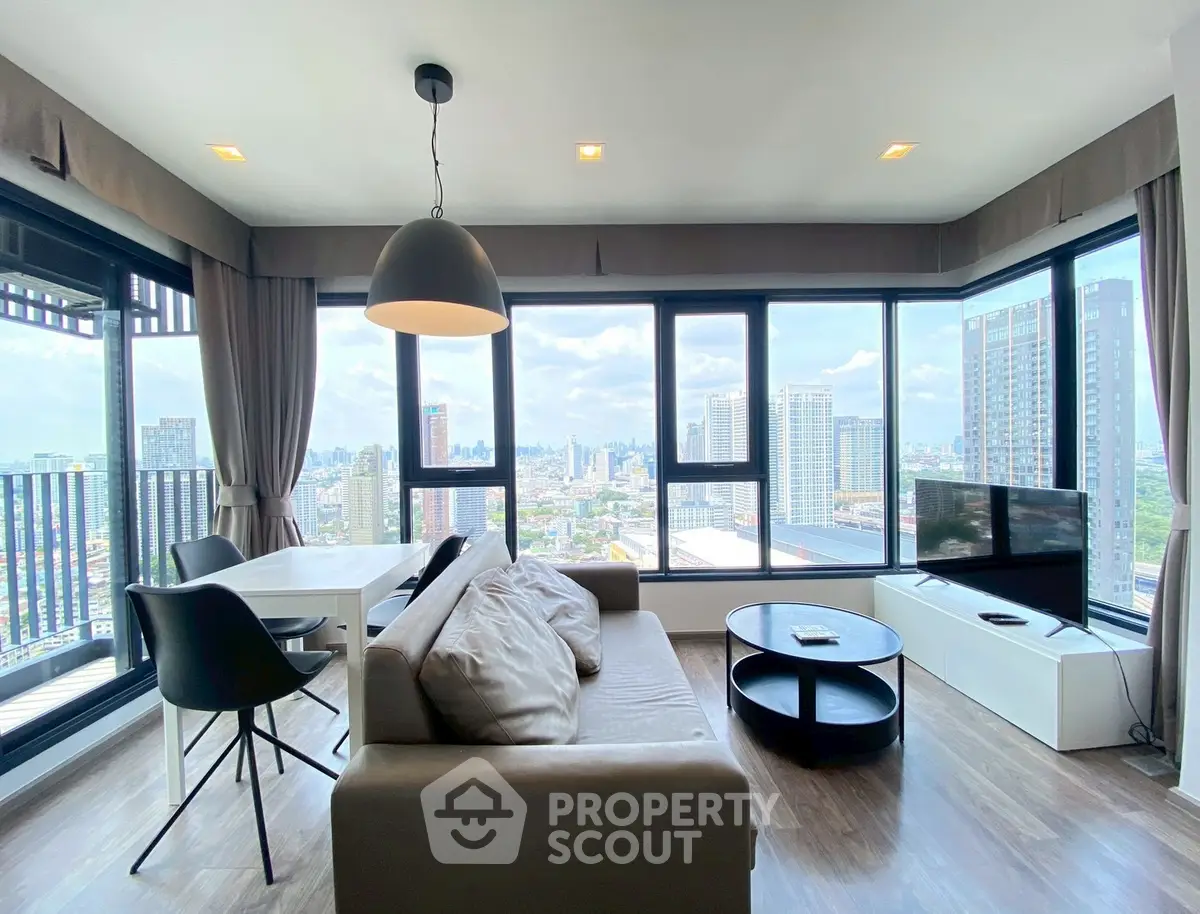 Modern living room with panoramic city view and stylish furnishings
