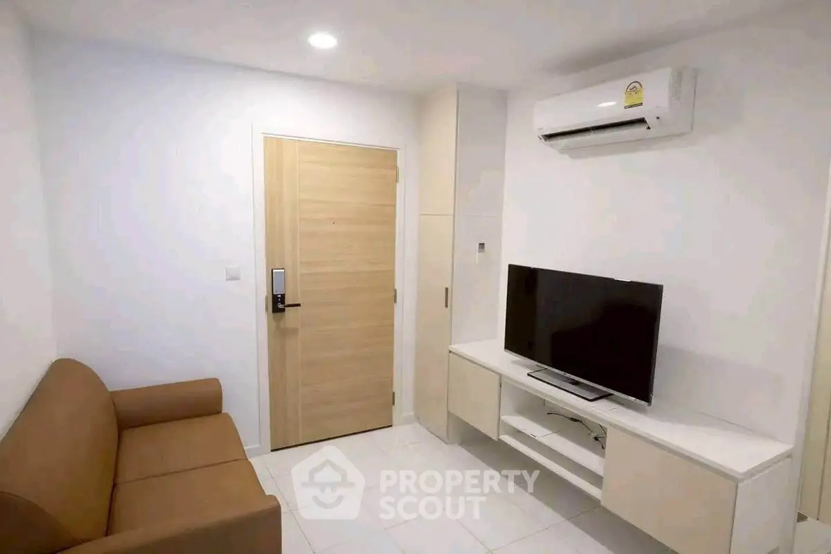 Modern living room with air conditioning and sleek TV setup