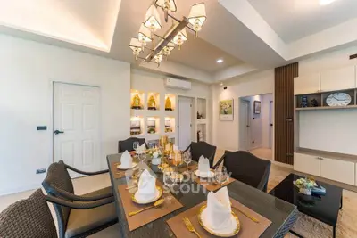 Elegant dining room with modern decor and ambient lighting in a luxurious home.