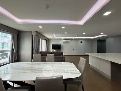 Spacious modern living room with elegant dining area and sleek lighting