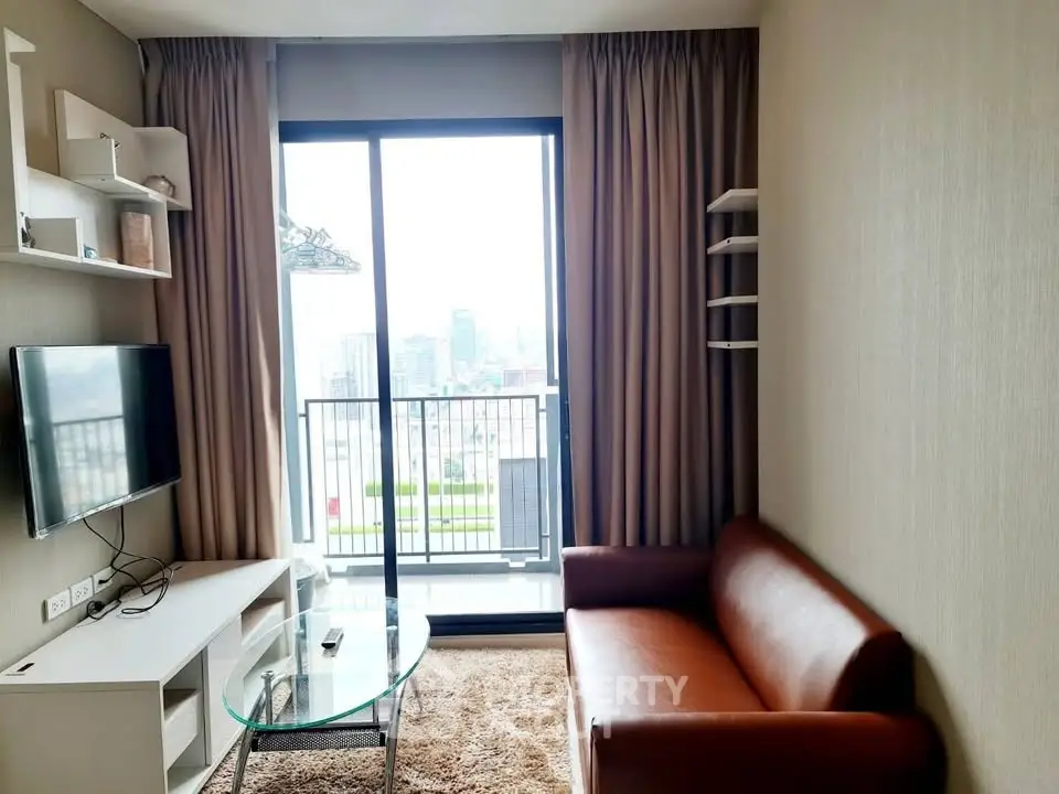 Modern living room with city view, featuring a cozy sofa, wall-mounted TV, and glass coffee table.