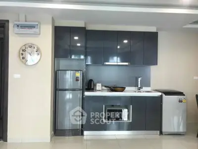 Modern kitchen with sleek cabinets, stainless steel appliances, and a minimalist design.