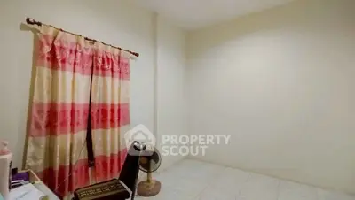 Minimalist room with tiled floor and colorful curtains, perfect for creative design ideas.