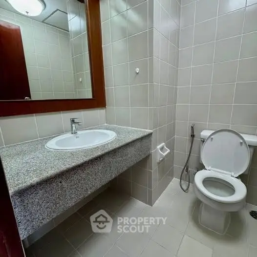 Modern bathroom with sleek fixtures and neutral tile design