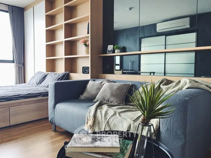 Modern living room with cozy sofa and stylish decor in a contemporary apartment.