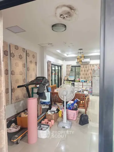 Spacious living room with exercise equipment and modern decor