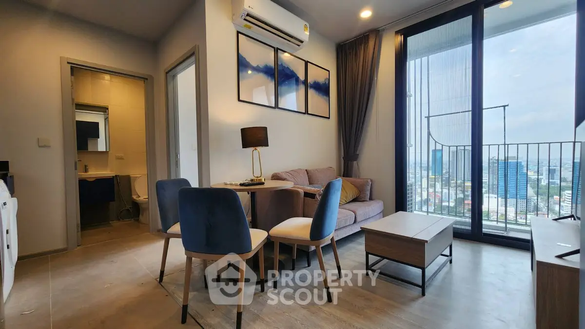 Modern living room with balcony view in high-rise apartment