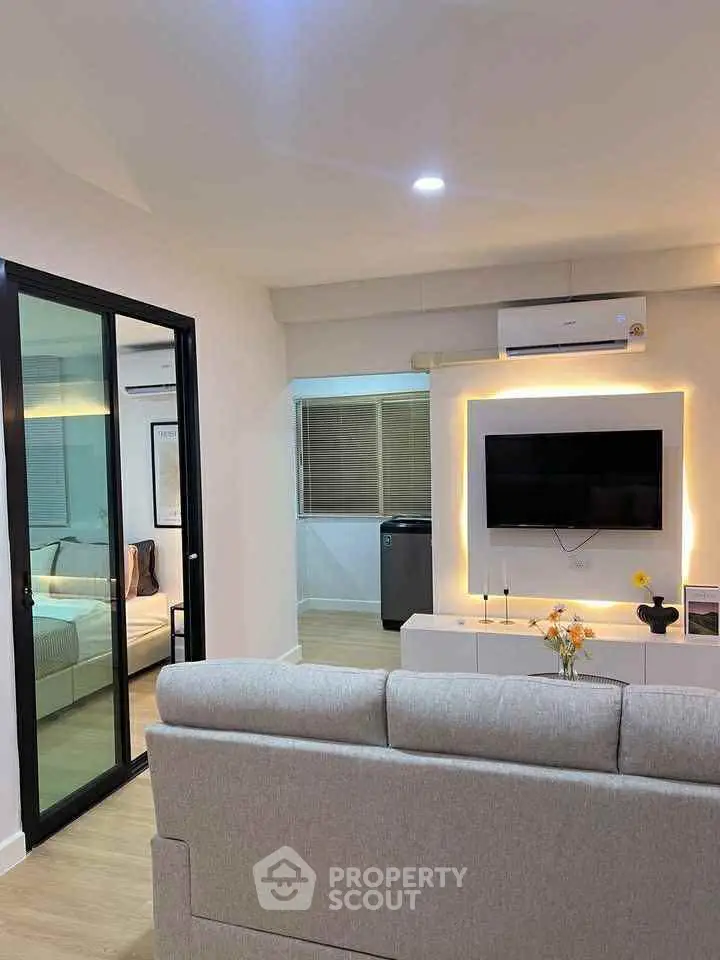 Modern living room with sleek design and ambient lighting