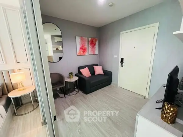 Modern living room with stylish decor and cozy seating in a contemporary apartment.
