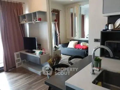 Modern living room with stylish decor and open kitchen layout