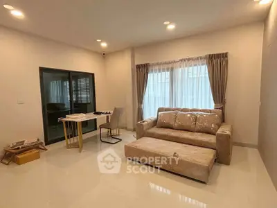 Spacious modern living room with elegant sofa and natural light