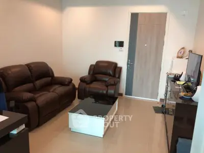 Cozy living room with leather sofas and modern decor