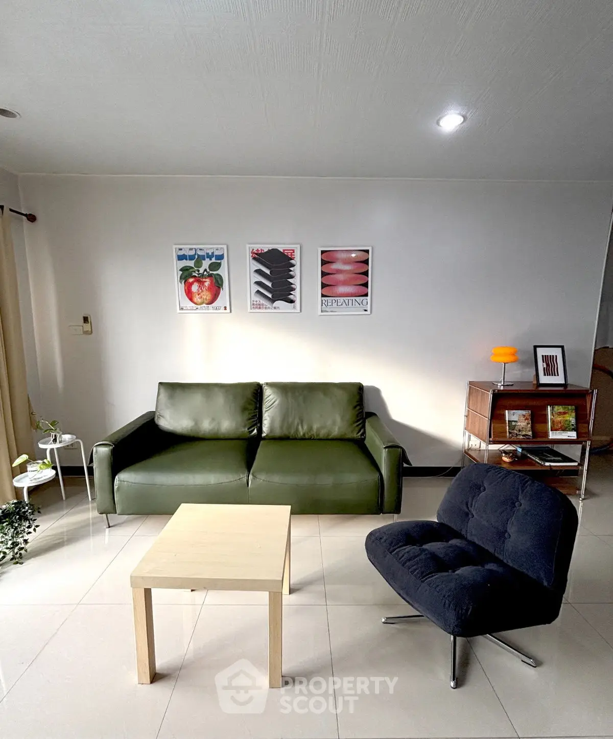 Modern living room with stylish furniture and wall art