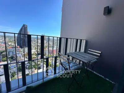 Stunning high-rise balcony with cityscape view, perfect for relaxation and enjoying urban living.