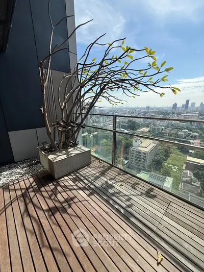 Stunning balcony with panoramic city views and modern design, perfect for relaxation and enjoying the skyline.
