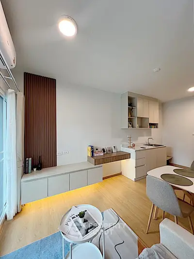 Modern living room with stylish decor and open kitchen layout