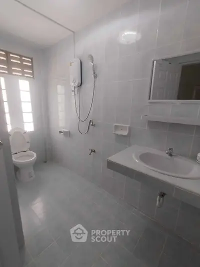 Spacious bathroom with modern fixtures and natural light