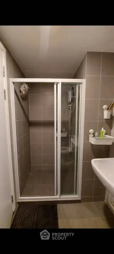 Modern bathroom with sleek shower enclosure and stylish fixtures