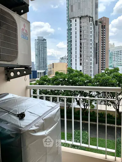 Urban balcony view with city skyline and lush greenery, perfect for city living enthusiasts.