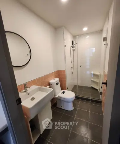 Modern bathroom with sleek design and glass shower enclosure