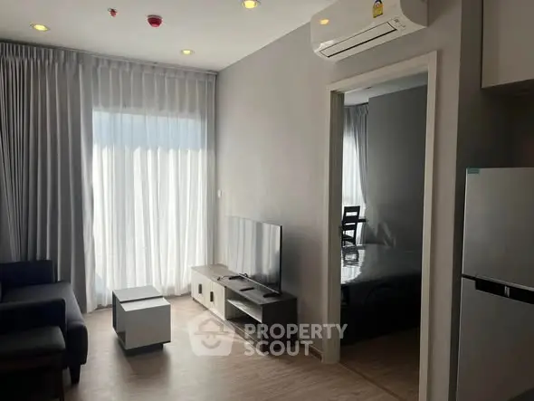 Modern living room with sleek furniture and natural light