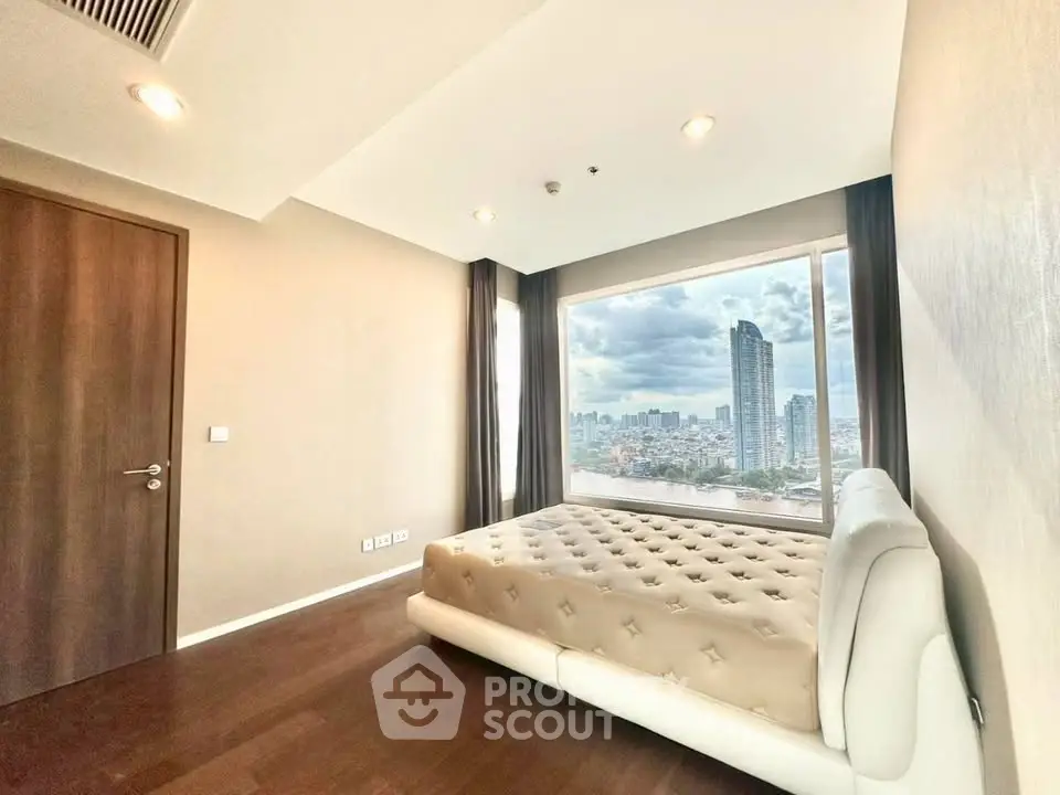 Luxurious bedroom with stunning city view and elegant decor