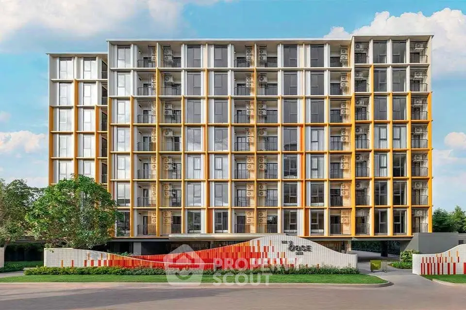 Modern apartment building with unique facade design and lush surroundings.