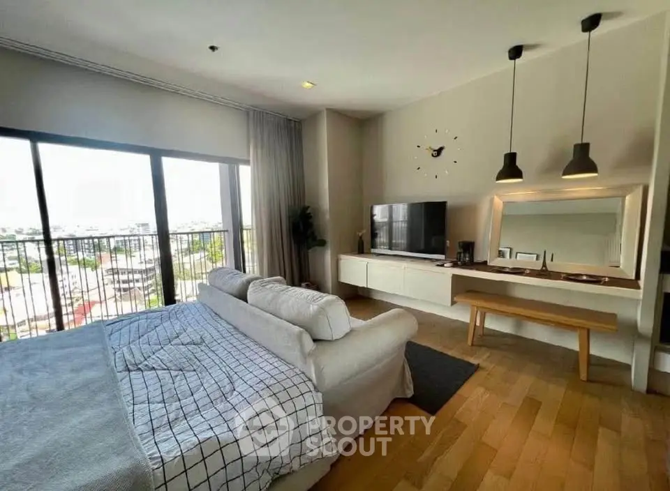 Spacious modern living room with large windows and stylish decor
