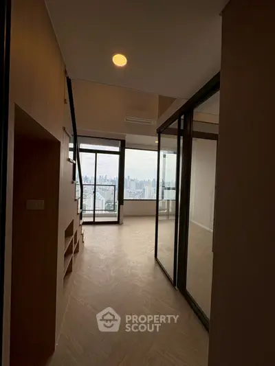 Modern apartment with glass partitions and stunning city view