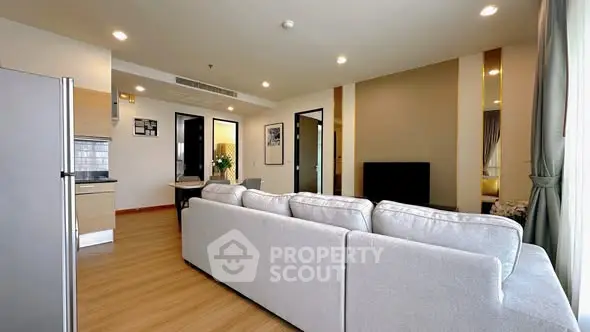 Spacious modern living room with open kitchen and elegant decor