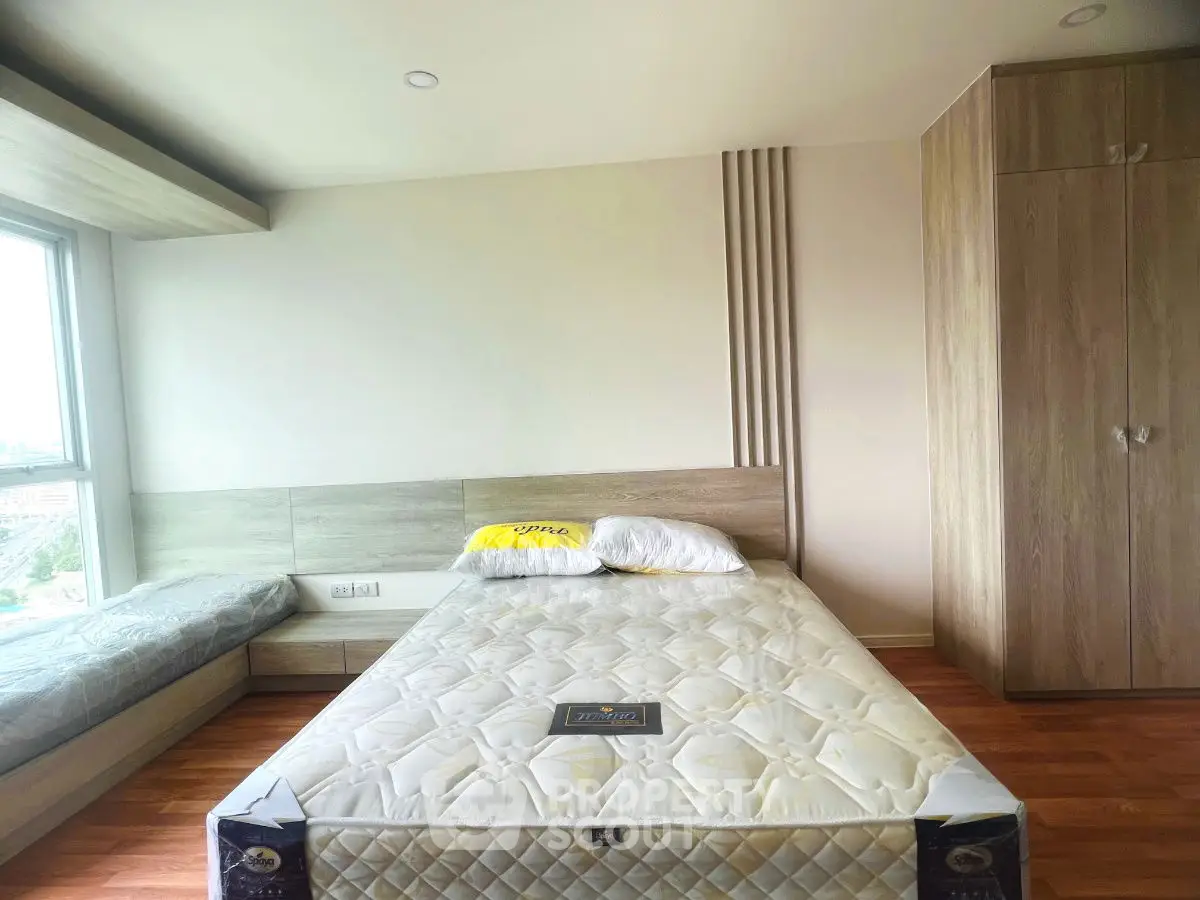 Spacious bedroom with modern design and large window view
