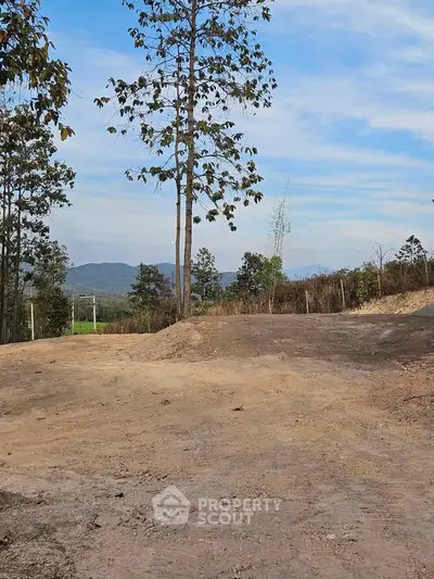 Scenic land plot with mountain views, ideal for development or investment.