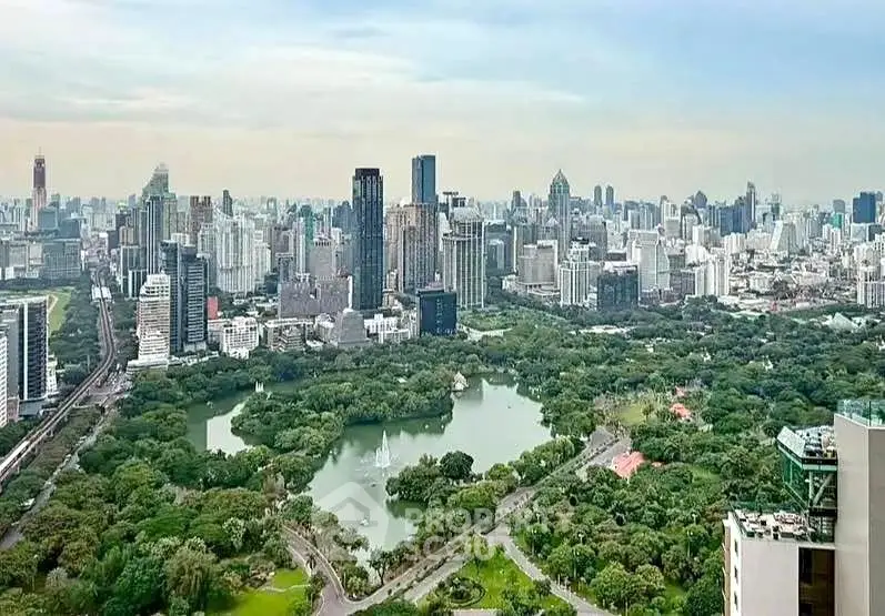 Stunning cityscape view with lush green park and skyline, perfect for urban living enthusiasts.