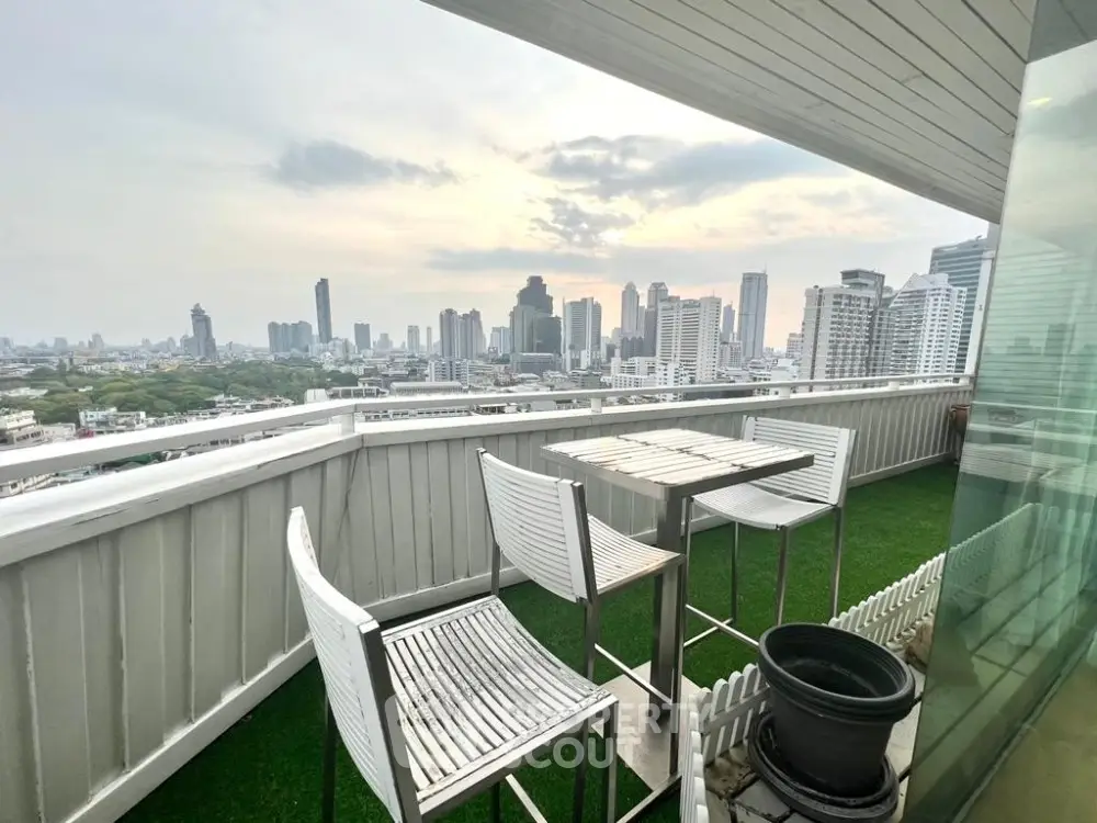 Stunning cityscape view from modern balcony with stylish seating area