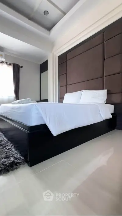 Luxurious bedroom with modern design and plush bedding
