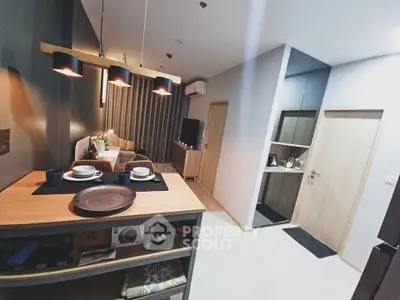 Modern open-plan living room with stylish lighting and cozy decor